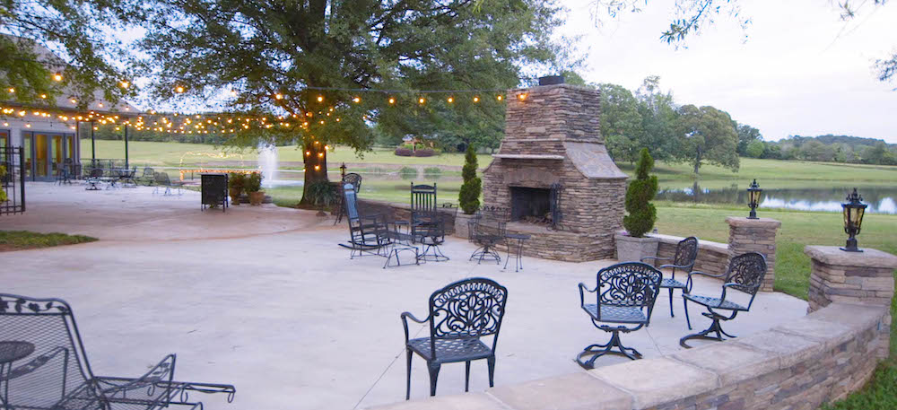 lights hang over the patio right outside of the wedding venue