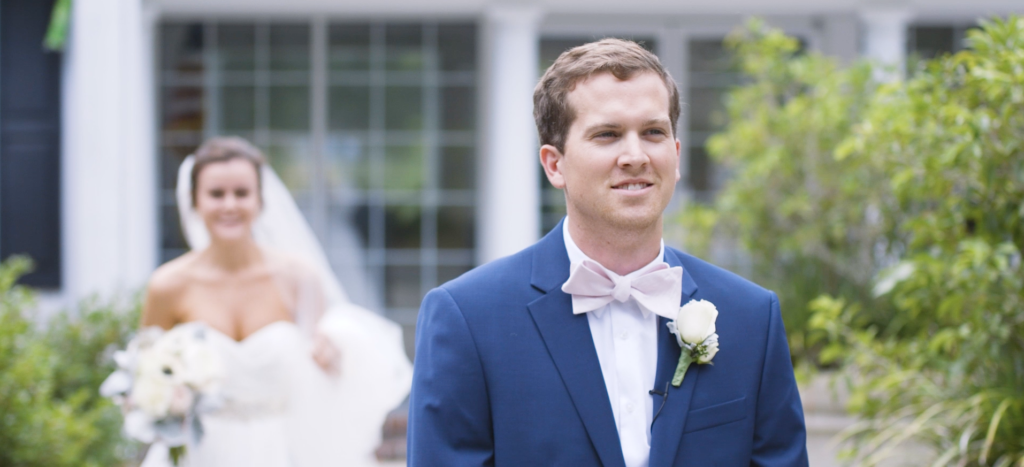 bride approaches the groom during first look