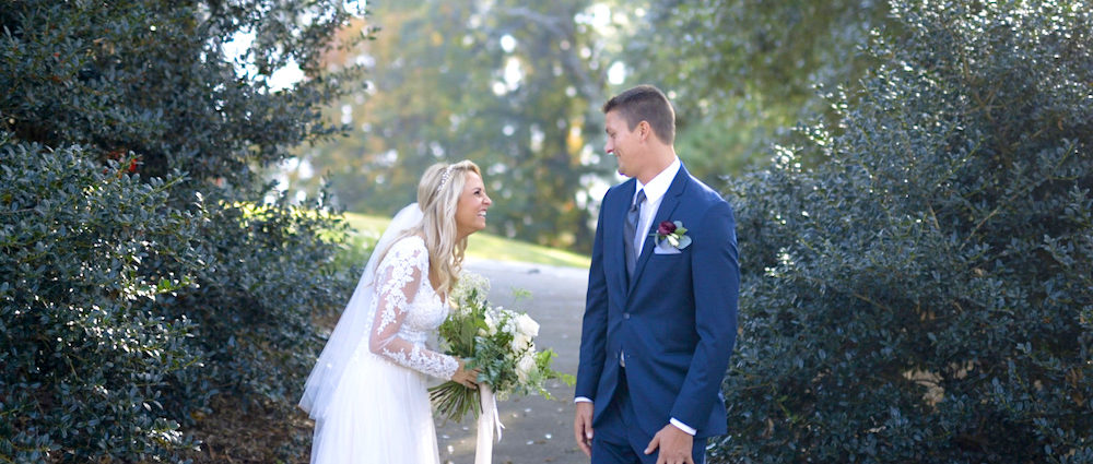 bride and groom smile during the first look