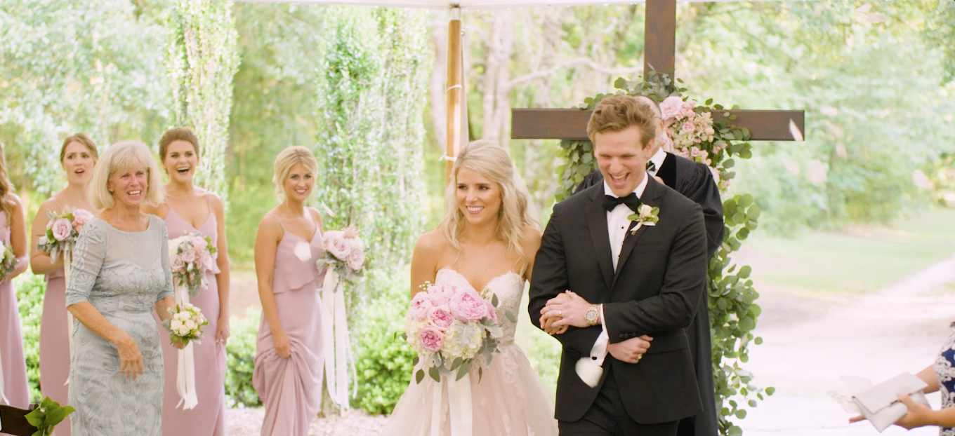 Husband and wife just married walking down the aisle