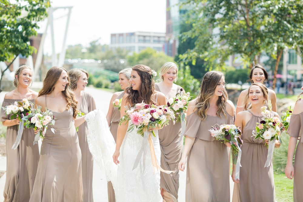 bride and bridesmaids walk in the city