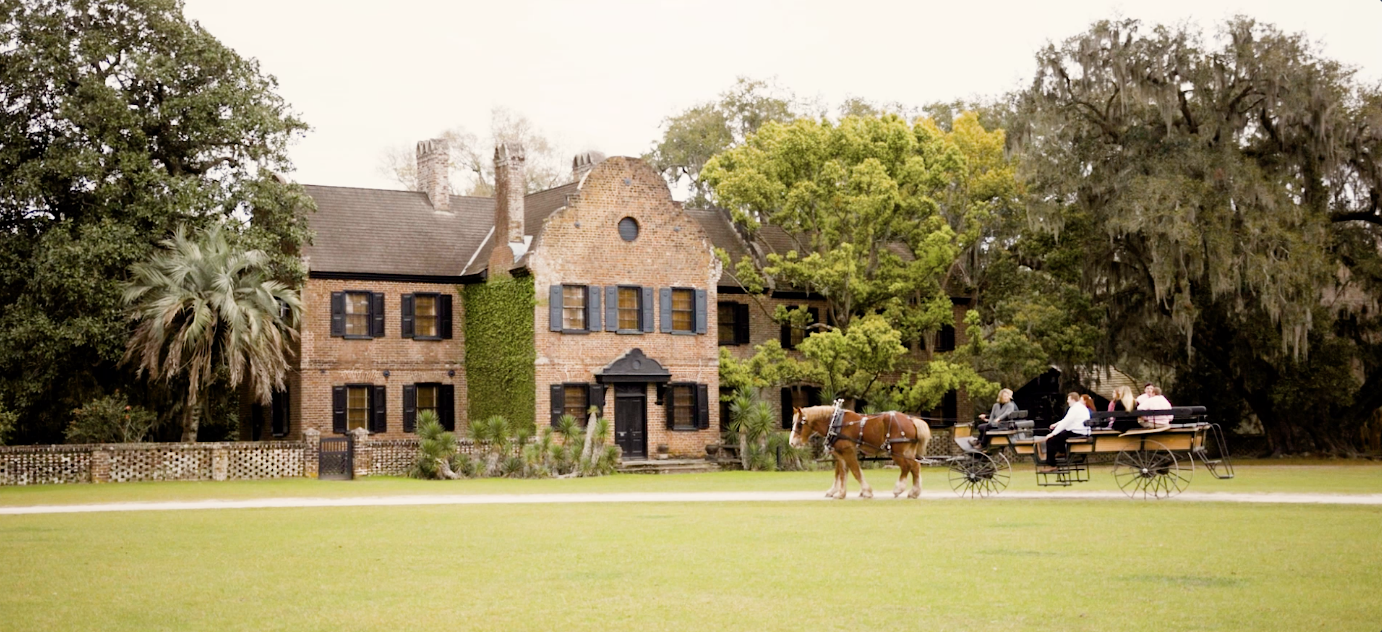 Horse and carriage in front of stone house