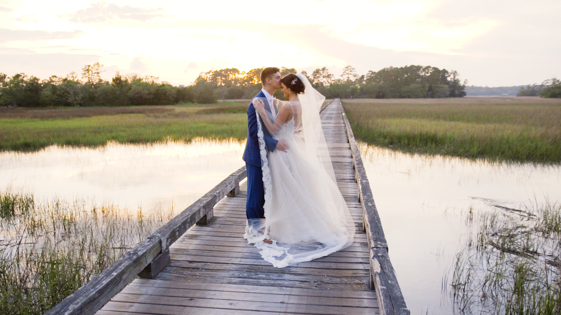 bride and groom on boardwalk