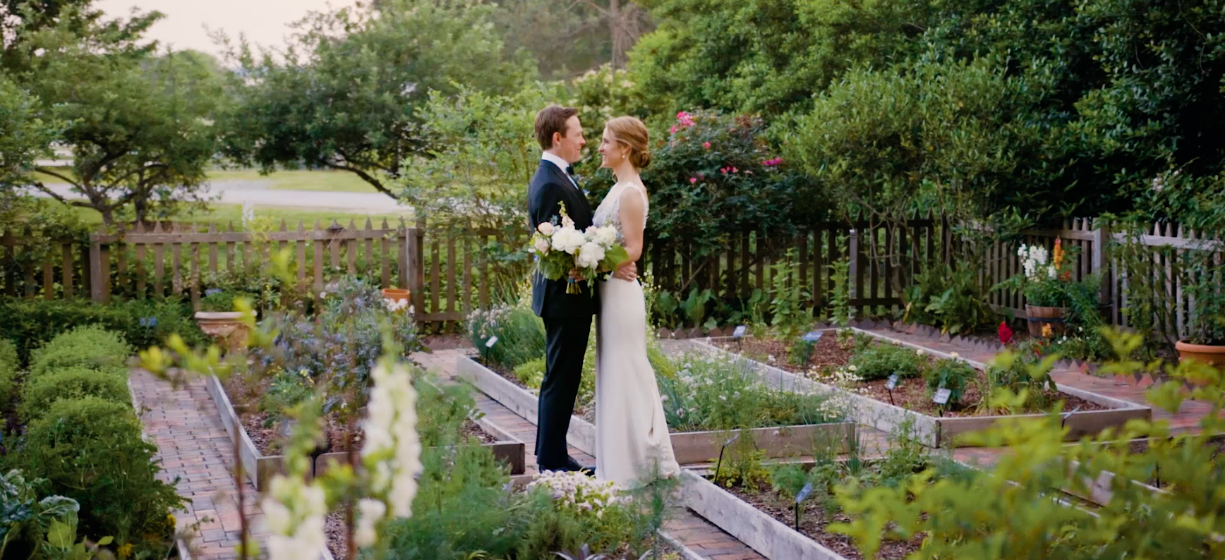 bride and groom in a garden